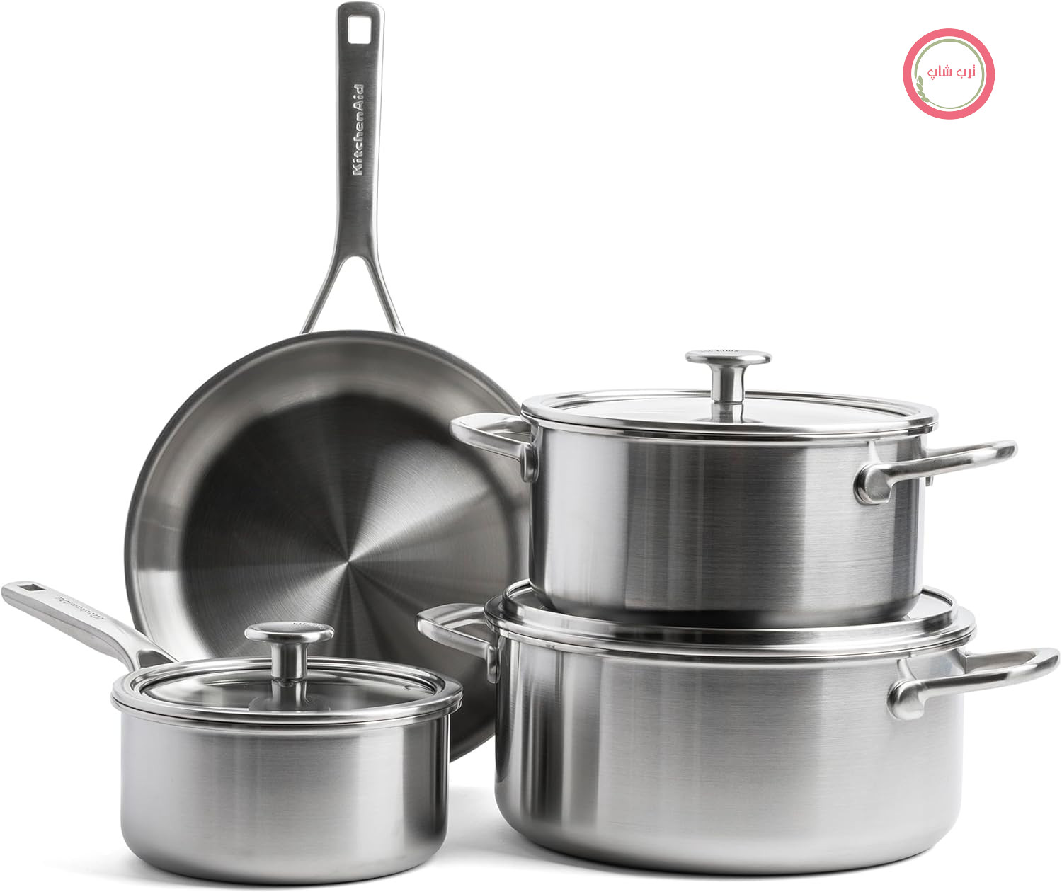 ست کامل لوازم آشپزی KitchenAid MultiPly با 7 قطعه، شامل تابه، قابلمه، ماهیتابه، و غیره، ساخته شده از استیل ضد زنگ و بدون PFA، مناسب برای انواع اجاق‌ها (از جمله فر)، تا دمای 220 درجه سانتیگراد، قابل شستشو در ماشین ظرفشویی، با رنگ نقره‌ای.